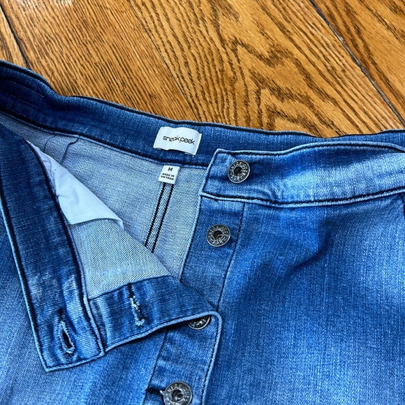 Sneak Peek denim raw hem mini skirt. Button front.  Front pockets. Medium. - Picture 11 of 11